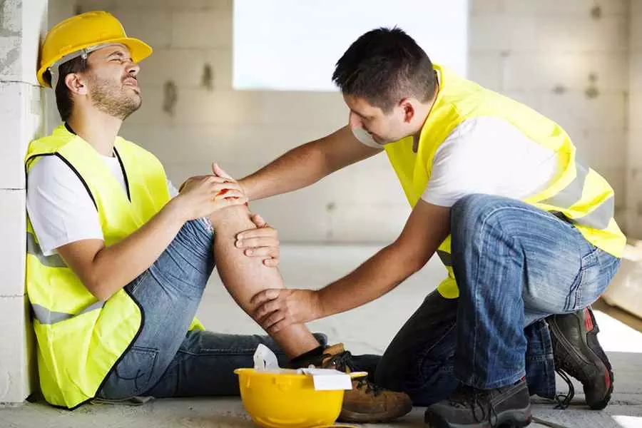 Construction crew at worksite wearing safety gear