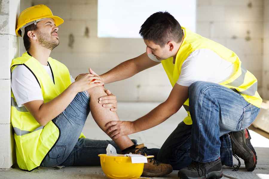 Construction crew at worksite wearing safety gear